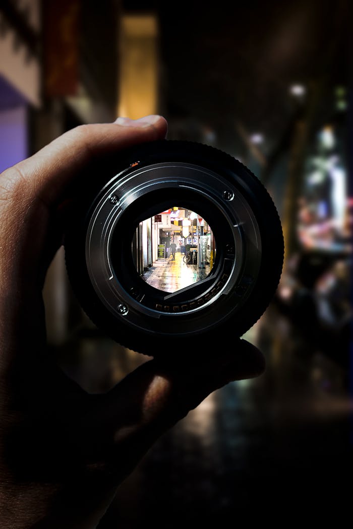 A unique perspective of Düsseldorfs city streets seen through a camera lens at night.